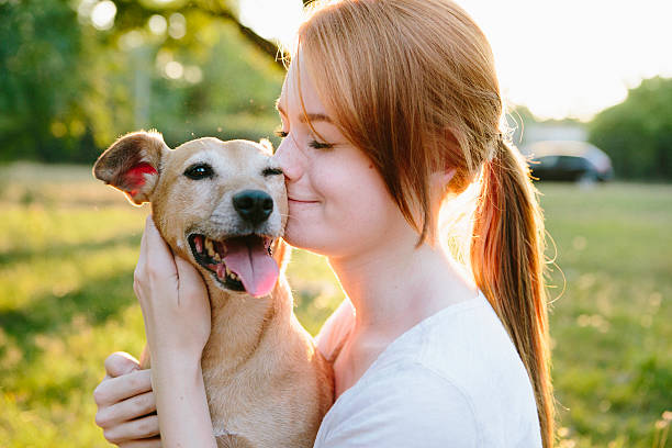 redhead teenage girl and her dog portrait