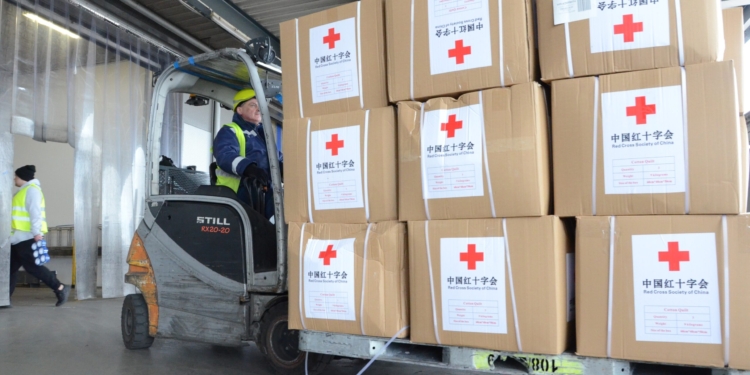 Humanitarian aid supplies sent by the Red Cross Society of China to the Ukrainian Red Cross Society are transported in Warsaw, Poland, March 15, 2022. The Red Cross Society of China announced Monday that it has sent a third batch of emergency humanitarian aid supplies to the Ukrainian Red Cross Society.   The new supplies, including milk powder for children and quilts, left Beijing on Monday and arrived in Warsaw, Poland. They will then be transported to Ukraine. (Photo by Chen Chen/Xinhua via Getty Images)