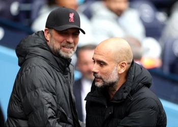 Soccer Football - Premier League - Manchester City v Liverpool - Etihad Stadium, Manchester, Britain - April 10, 2022 Manchester City manager Pep Guardiola and Liverpool manager Juergen Klopp before the match Action Images via Reuters/Carl Recine EDITORIAL USE ONLY. No use with unauthorized audio, video, data, fixture lists, club/league logos or 'live' services. Online in-match use limited to 75 images, no video emulation. No use in betting, games or single club /league/player publications.  Please contact your account representative for further details.