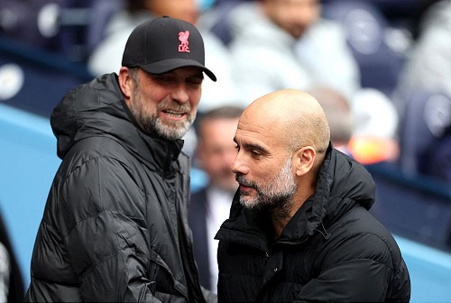 Soccer Football - Premier League - Manchester City v Liverpool - Etihad Stadium, Manchester, Britain - April 10, 2022 Manchester City manager Pep Guardiola and Liverpool manager Juergen Klopp before the match Action Images via Reuters/Carl Recine EDITORIAL USE ONLY. No use with unauthorized audio, video, data, fixture lists, club/league logos or 'live' services. Online in-match use limited to 75 images, no video emulation. No use in betting, games or single club /league/player publications.  Please contact your account representative for further details.