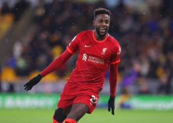 WOLVERHAMPTON, ENGLAND - DECEMBER 04:  Divock Origi of Liverpool celebrates after scoring the winning goal during the Premier League match between Wolverhampton Wanderers and Liverpool at Molineux on December 04, 2021 in Wolverhampton, England. (Photo by James Gill - Danehouse/Getty Images)