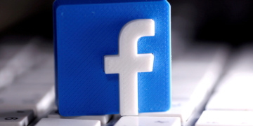 FILE PHOTO: A 3D-printed Facebook logo is seen placed on a keyboard in this illustration taken March 25, 2020. REUTERS/Dado Ruvic/Illustration